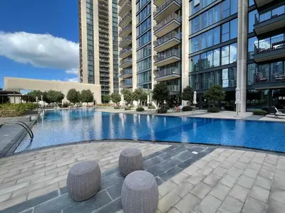 a swimming pool in the middle of a building at Silkhaus Serene 1BR at Boulevard Heights in Downtown in Dubai