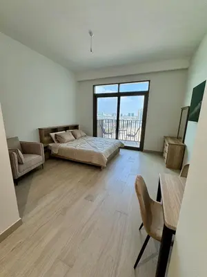 a large bedroom with a bed and a large window at Dubai - Brand New Apartment in Dubai