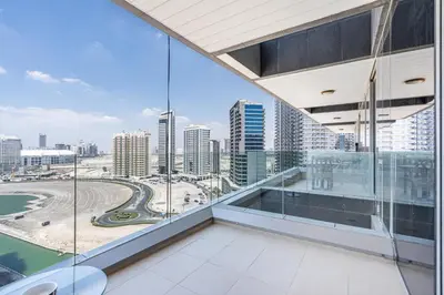 a view of the city from the balcony of a building at Premium & Cozy Home in the Heart of Sports City in Dubai