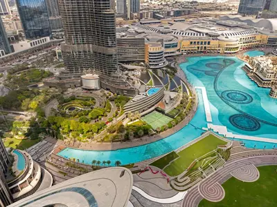 an aerial view of a city with a pool at Crown Jewel 2 Bedroom Apartments I Iconic Burj Khalifa and Fountain Views I Free Parking, Gym, Pool, Wi-Fi and PS5 I by Skyline Serenity in Dubai