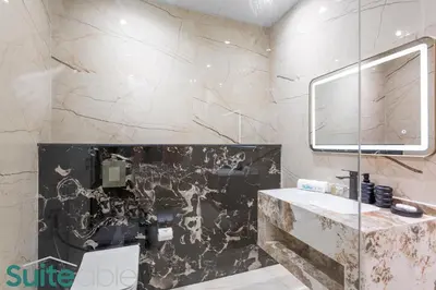 a bathroom with a sink and a mirror at Stylish 1 Bedroom near metro station in JLT in Dubai