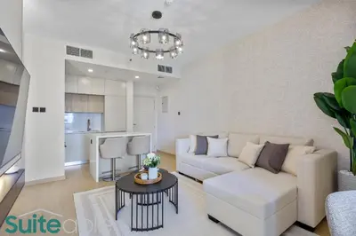 a living room with a couch and a table at Stylish 1 Bedroom near metro station in JLT in Dubai