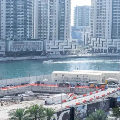 a city with a bridge over a river and buildings at Business Bay Mahek Holiday Home in Dubai