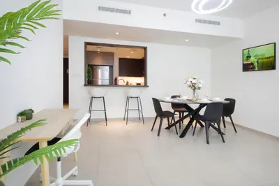 a dining room with a table and chairs at Spacious 2BHK Boulevard Heights Downtown in Dubai