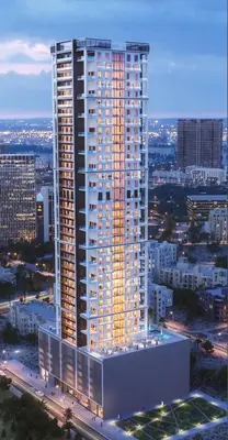 a tall building with lights on in a city at PurityStaysDXB in Dubai