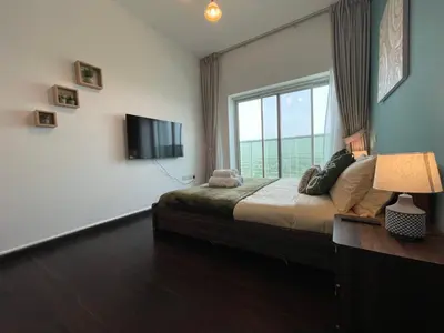 a bedroom with a bed and a large window at Ultra Luxury Chic 2Bed in Dubai in Dubai