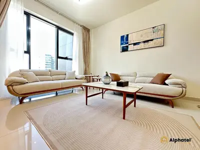 a living room with two couches and a coffee table at Elegant 1-Bedroom Apartment in Dubai Silicon Oasis - by Alphatel Vacations in Dubai