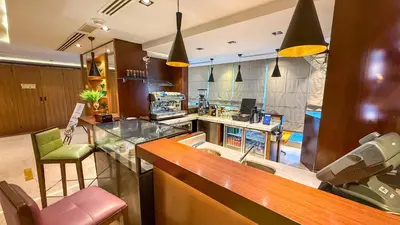 a kitchen with a counter with a sink and a counter at Central Apartment in Dubai Heart in Dubai