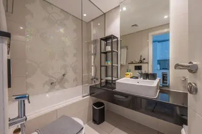 a bathroom with a sink and a bath tub at Central Apartment in Dubai Heart in Dubai