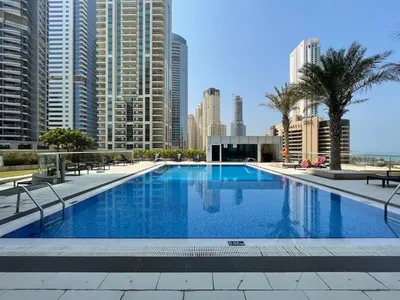 a large swimming pool in a city with tall buildings at GuestReady - Fantastic retreat with Palm views in Dubai