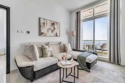 a living room with a couch and a table at GuestReady - Fantastic retreat with Palm views in Dubai
