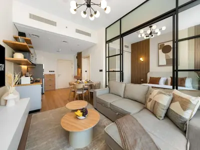 a living room with a couch and a table at Contemporary 1BR in Collective 2.0 Luxury and Comfort in Dubai