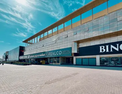 a large building with a brick road in front of it at Al Manara Classic Executive Studio in Dubai