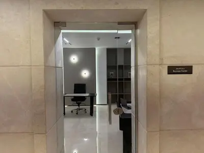 an office space with a desk and a glass wall at Standpoint Tower by Luxe Living in Dubai