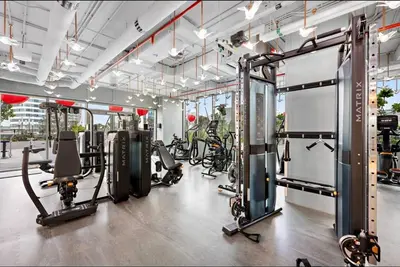 a gym with several treadmills and exercise bikes at Mag 318 - 3 min walk to Dubai Mall - Luxury Studio - Pool & SLS View in Dubai