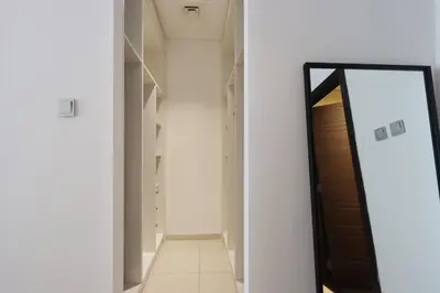 a mirror in a hallway next to a door at Livbnb-Spacious 2 BR in Dubai Marina with Balcony in Dubai