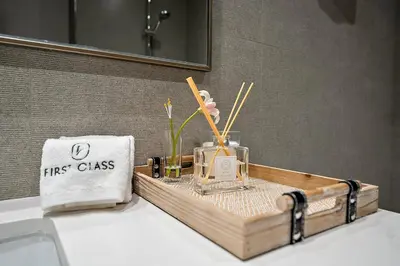 a first class bathroom with a first class box on a sink at FIRST CLASS 2BR Burj Khalifa & Fountain view in Dubai