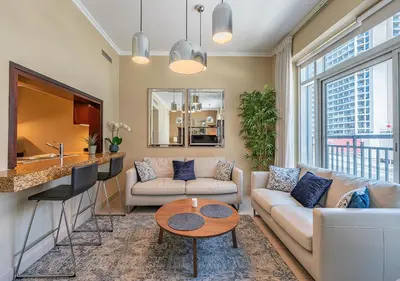 a living room with a couch and a table at Luxurious Studio in Downtown Dubai in Dubai