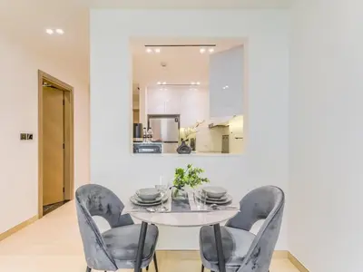 a dining room with a table and chairs at TRPS - Binghatti Nova, Jumeirah Village Circle - Premium 1BR with Great Amenities in Dubai