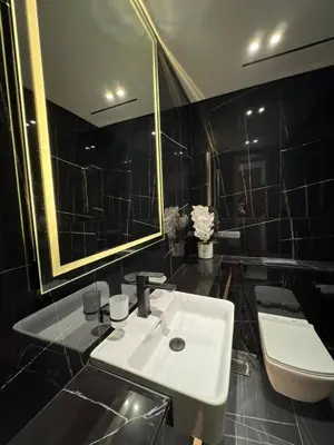 a bathroom with a sink and a toilet and a mirror at Spacious Luxury 1br Jvc Balcony & Pool in Dubai