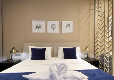 a bedroom with a bed with two towels on it at Elegant Studio with Canal Views DAMAC Prive in Dubai