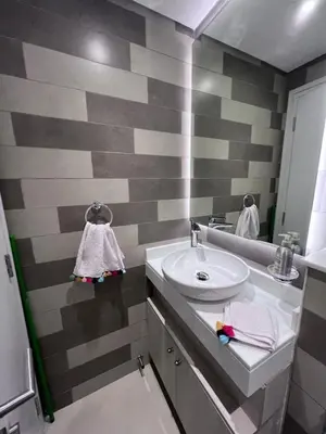 a bathroom with a sink and a mirror at Stunning 1 bedroom apartment in Seven Palm Dubai in Dubai