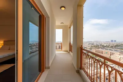 a balcony with a view of a city at Marina Residence 4, Palm Jumeirah - Mint Stay in Dubai