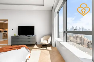 a bedroom with a bed and a large window at Keysplease Upgraded Interiors Luxury Palm Tower 1 BR in Dubai