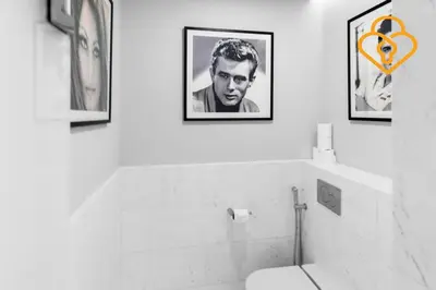 a bathroom with three pictures on the wall at Keysplease Upgraded Interiors Luxury Palm Tower 1 BR in Dubai