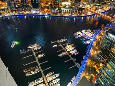 a group of boats in a marina at night at Vida Yacht Club # Up-scale 2BHK # Marina,Sea & Ain View in Dubai
