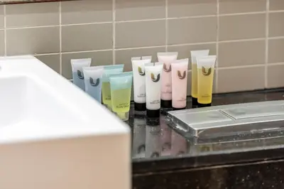 a group of different colored toothbrushes sitting on a counter at Luxury Studio in Dubai Marina with Canal views in Dubai