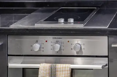 a stove top oven with a towel on it at Luxury Studio in Dubai Marina with Canal views in Dubai