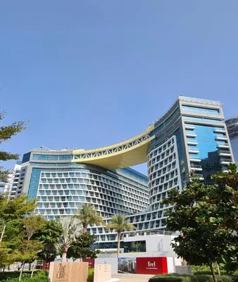 a large building with a curvingraper on top of it at High-floor 1 Bedroom by Seven Apartments Palm Jumeirah in Dubai