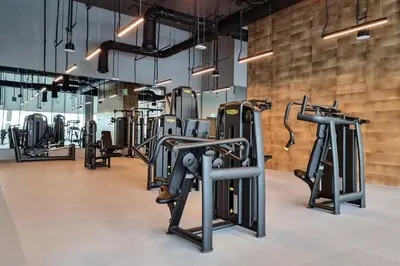 a gym with rows of exercise bikes in a room at KING 2BR LUX Apt-5mins Dubai Mall-Downtown Dubai in Dubai
