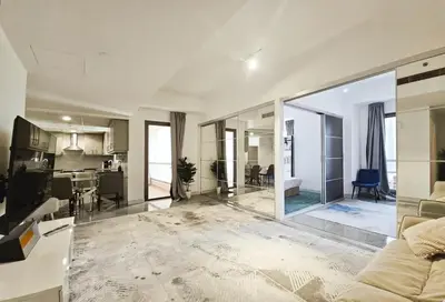 a living room and kitchen with a large glass wall at Ahlan Furnished Full Apartment Marina Cityview JBR Beach for Families in Dubai