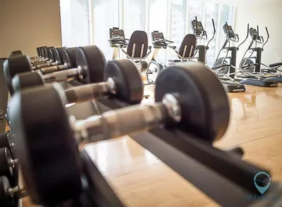 a row of rows of exercise bikes in a gym at 1BR Modern, Stylish l Mins to Beach l Dubai Marina in Dubai