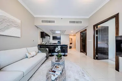 a living room with a couch and a table at 1 BD in Bay Central with the Iconic Marina Views in Dubai