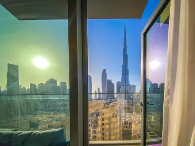 a view of a city skyline from a window at Majestic Burj Khalifa View 2BR Premium Apartment By SBH in Dubai