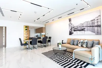 a living room with a couch and a table at Bright Modern 1BR Heart Of JLT Skyline Views in Dubai