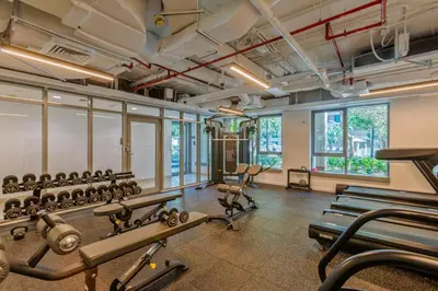 a fitness room with a lot of exercise equipment at Arabian Nights 1BR - Burj Khalifa & Fountain Views - 5 Mints Walk to Burj Khalifa and Dubai Mall in Dubai