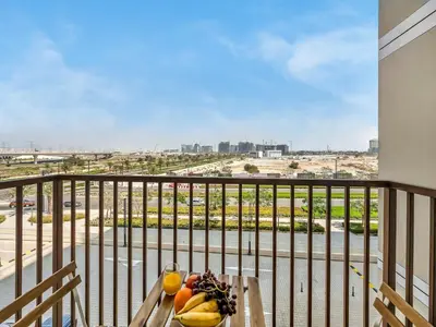 a bowl of fruit on a table on a balcony at Wonderful Stay at Collective 2- Unique in Dubai Hills - 5 min to Dubai Hills Mall - Brand New Luxury Apartments in Dubai