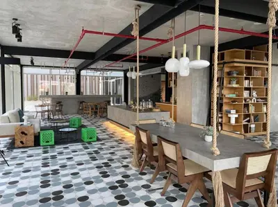 a living room with a table and chairs and a couch at Wonderful Stay at Collective 2- Unique in Dubai Hills - 5 min to Dubai Hills Mall - Brand New Luxury Apartments in Dubai