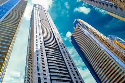 two tall buildings in a city with a blue sky at 1BR Cool Vibes Pool Views Dubai Marina in Dubai