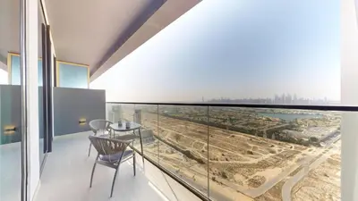 a room with a balcony with a view of a city at Binghatti Onyx - Upgraded One Bedroom in JVC in Dubai