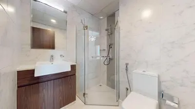 a bathroom with a shower and a sink and a toilet at Vacationer I Exclusive 2 Bedroom I Breathtaking Skyline & City Views I Afnan 1 - IMPZ in Dubai
