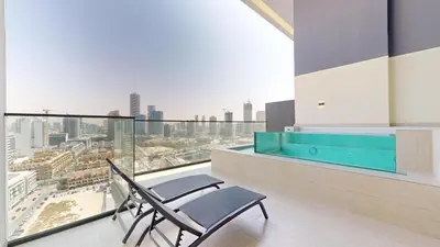 a chair on a balcony with a view of a city at Binghatti Onyx - Two Bedroom with Private Pool in Dubai
