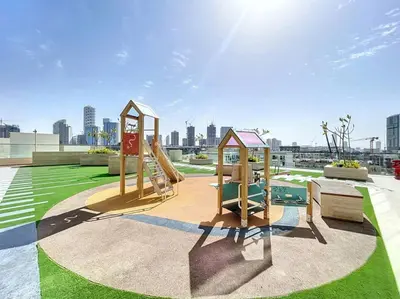 a playground with a slide in a park at Binghatti Onyx - Two Bedroom with Private Pool in Dubai