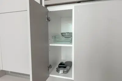 a closet with white doors and a shelf at New 2BR with BBQ Area, Pool in Sobha MBR City in Dubai