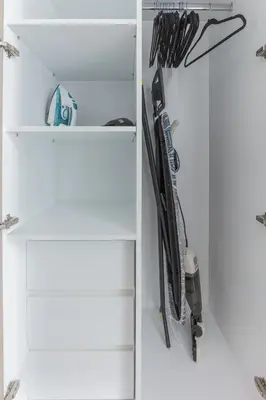 a white refrigerator filled with lots of knives at Beautiful view, fully-equipped apartment in Dubai