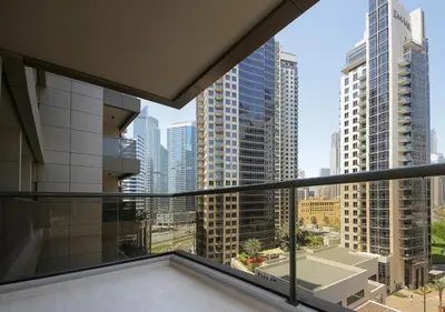 an apartment balcony with a view of a city at Luxury 3BR Apartment By Elite Residence Downtown in Dubai